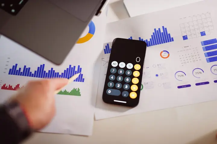 Student calculating the total cost of textbooks